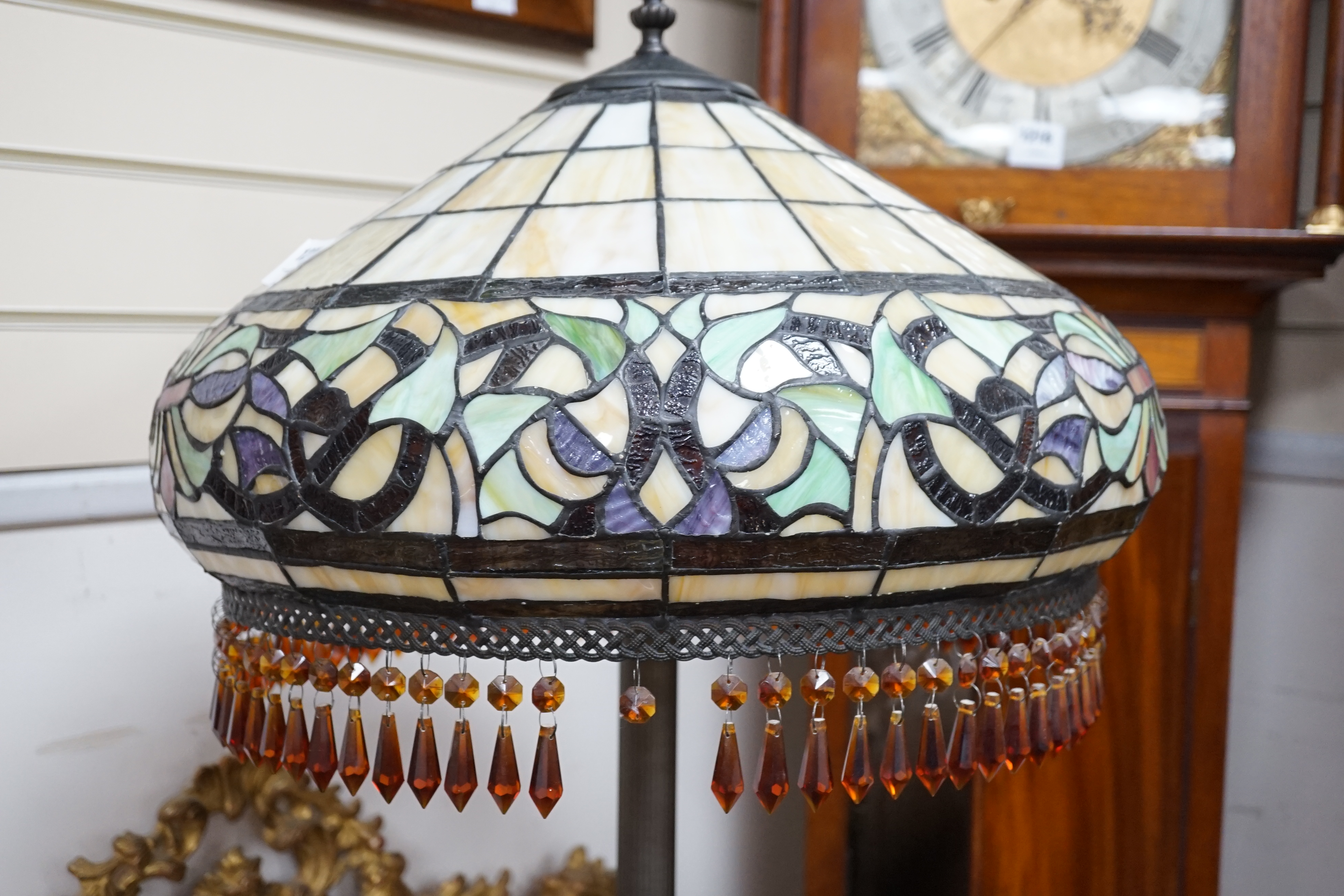 A Tiffany style leaded glass and bronzed metal lamp standard, height 164cm